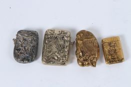 A COLLECTION OF FOUR METAL NOVELTY VESTAS.