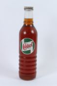 A BOTTLE OF CASTROL MOTOR OIL.