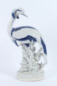A LARGE CONTINENTAL PORCELAIN BLUE AND WHITE HERON. 48CMS HIGH.