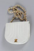 A CHANEL WHITE PADDED BAG with gilt double C and gilt chain. 19cms long, with dust cover. Sold