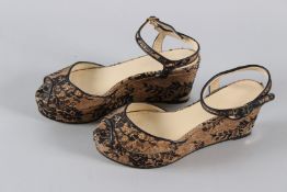 A PAIR OF JIMMY CHOO SNAKESKIN SHOES. Size 38, with dust bag.