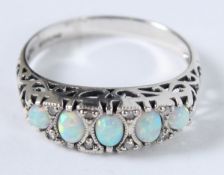 A SILVER VICTORIAN STYLE OPAL AND DIAMOND RING.