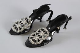 A PAIR OF CHANEL BLACK DIAMANTE SLIP-ON SHOES. Size 38, with dust bag.