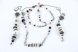 A LARGE VINTAGE CHANEL BLACK AND WHITE NECKLACE with two double C's.