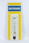 A VINTAGE TALL DUCKHAMS THERMOMETER ENAMEL SIGN. 92cms x 33cms.