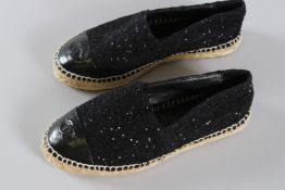 A PAIR OF CHANEL BLACK LEATHER SEQUIN ESPADRILLES. Size 36, with dust bag.