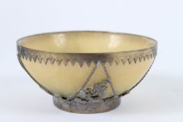 A VINTAGE ASIAN STONE CIRCULAR BOWL with metal overlay.