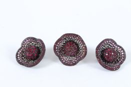 A DIAMANTE RING AND A PAIR OF EARRINGS.