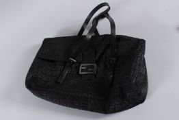 A FENDI BLACK BAG with chrome clasp and plain leather handle. 40cms long, with dust cover. Sold with