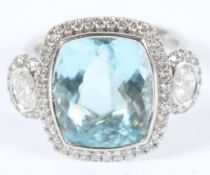 A LARGE 18CT WHITE GOLD AQUAMARINE AND DIAMOND RING. Aqua stone 7ct. Diamond 1.33ct. Size N.
