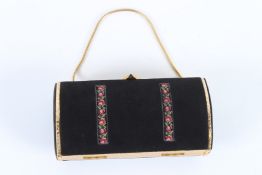 A VINTAGE BLACK AND CREAM CLUTCH BAG. 16cms high.