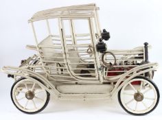 A GOOD MODEL OF A VINTAGE CAR made from wood and metal. 100cms long.
