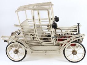 A GOOD MODEL OF A VINTAGE CAR made from wood and metal. 100cms long.