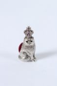 A SILVER CAT CROWN PIN CUSHION.