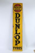 A LONG VINTAGE DUNLOP TYRES ENAMEL SIGN. 4m x 30cms.