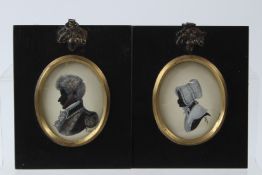 DOROTHY TURTON two silhouettes An army officer and a girl initialled in oval mounts 6 x 5cm (2)