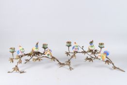 A PAIR OF PORCELAIN AND GILT METAL BIRD CANDLESTICKS, each with three birds and two candleholders.