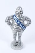 A METAL MODEL OF THE MICHELIN MAN.