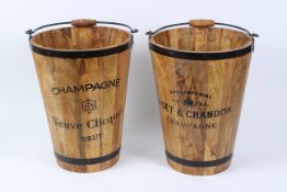 A PAIR OF CHAMPAGNE WOODEN BUCKETS.