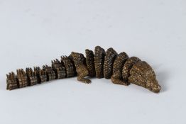 AN ARTICULATED BRONZE CROCODILE. 16cms high
