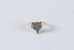 A GOOD DIAMOND SET FOXES' HEAD RING.