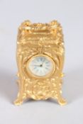 A GILT BRONZE ROCOCO MINIATURE CARRIAGE CLOCK. 2.75ins high