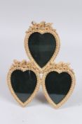 A GILT TRIPLE HEART SHAPED PICTURE FRAME. 13ins high