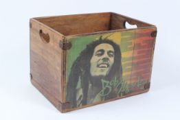 A STORAGE BOX DECORATED WITH BOB MARLEY.