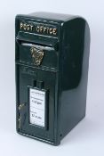 A REPRODUCTION CAST IRON POST BOX.