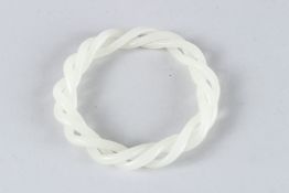 A RETICULATED WHITE JADE BANGLE. 8cms diameter