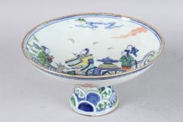 A CHINESE PORCELAIN TAZZA with figures in a cart being pulled by a deer