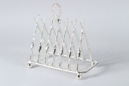 A SILVER PLATED CROSS RIFLES TOAST RACK