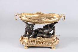 A VERY GOOD LOUIS XVITH DESIGN BRONZE AND ORMOLU CUPID CENTREPIECE with ring handles. 20ins wide x