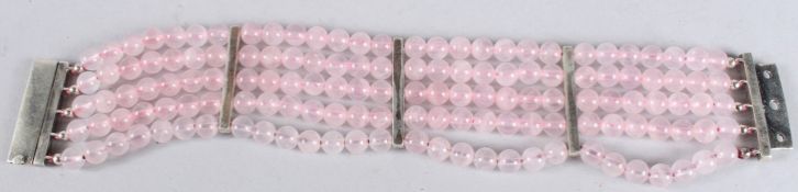 A SILVER GILT AND ROSE QUARTZ BRACELET