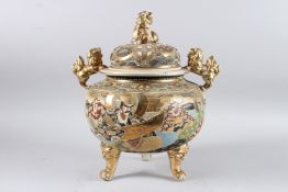 A LARGE JAPANESE KORO AND COVER with kylin knop and handles, on three curving feet 40cm high