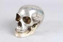 A SILVER PLATED SKULL