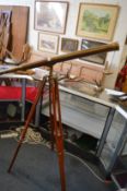 A BRASS TELESCOPE on tripod stand