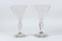 A GOOD PAIR OF GLASS VASES etched with birds. 24cms high