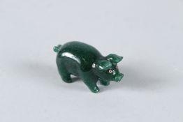 A RUSSIAN JADE PIG with gold and diamond eyes. 4.5cms high, in a Faberge box