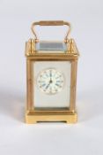 A MINIATURE SILVER FACED CARRIAGE CLOCK. 2.25ins.