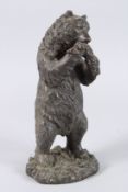 A GOOD BRONZE STANDING BEAR eating fish. 11ins high
