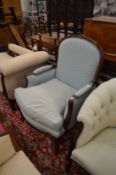 French style pale blue upholstered armchair with carved showood frame.