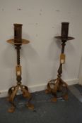 A pair of wrought iron candle stands.