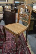 A set of ten Regency style rosewood and cane seated dining chairs.