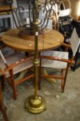 A telescopic brass floor standing lamp.
