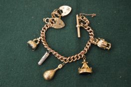 A gold charm bracelet.