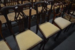 A pair of mahogany dining chairs and a Victorian chair.