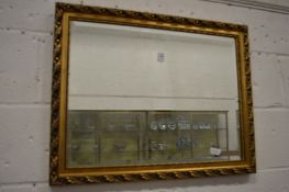 A gilt framed mirror.