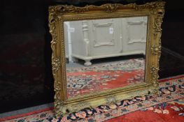 A small gilt framed mirror.