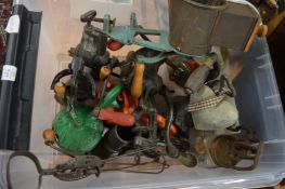 A collection of old fashioned cast iron mincers and related kitchenalia.